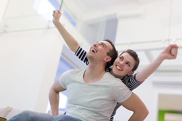 Image showing handsome man piggybacking his girlfriend