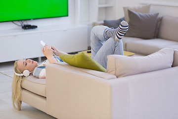 Image showing girl enjoying music through headphones