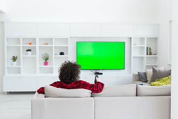 Image showing young man in bathrobe enjoying free time