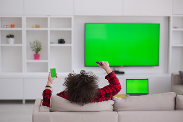 Image showing young man in bathrobe enjoying free time