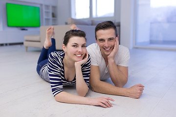 Image showing couple lying on the floor at home