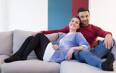 Image showing couple hugging and relaxing on sofa
