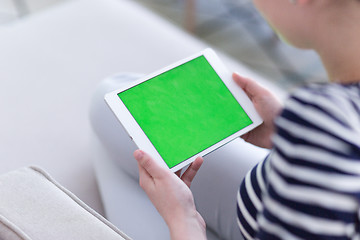 Image showing woman on sofa using tablet computer