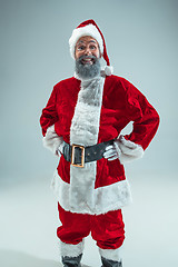 Image showing Funny guy in christmas hat. New Year Holiday. Christmas, x-mas, winter, gifts concept.