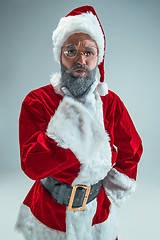 Image showing Funny guy in christmas hat. New Year Holiday. Christmas, x-mas, winter, gifts concept.