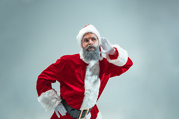 Image showing Funny guy in christmas hat. New Year Holiday. Christmas, x-mas, winter, gifts concept.