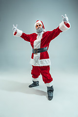 Image showing Funny guy in christmas hat. New Year Holiday. Christmas, x-mas, winter, gifts concept.