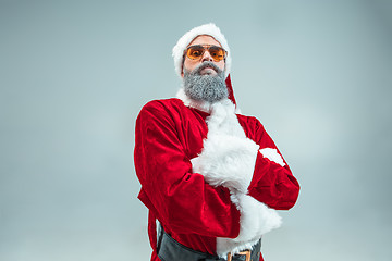 Image showing Funny guy in christmas hat. New Year Holiday. Christmas, x-mas, winter, gifts concept.