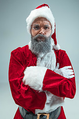 Image showing Funny guy in christmas hat. New Year Holiday. Christmas, x-mas, winter, gifts concept.