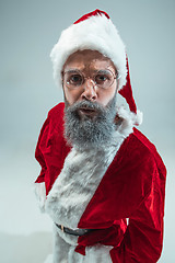 Image showing Funny guy in christmas hat. New Year Holiday. Christmas, x-mas, winter, gifts concept.