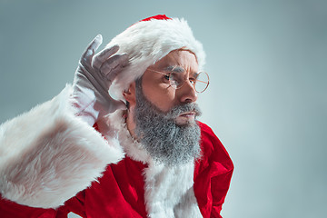 Image showing Funny guy in christmas hat. New Year Holiday. Christmas, x-mas, winter, gifts concept.