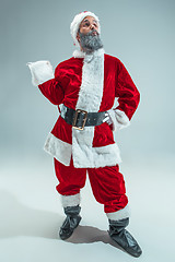 Image showing Funny guy in christmas hat. New Year Holiday. Christmas, x-mas, winter, gifts concept.