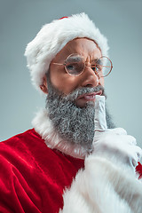 Image showing Funny guy in christmas hat. New Year Holiday. Christmas, x-mas, winter, gifts concept.