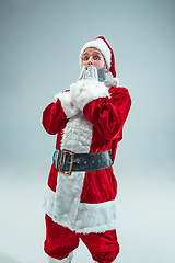 Image showing Funny guy in christmas hat. New Year Holiday. Christmas, x-mas, winter, gifts concept.