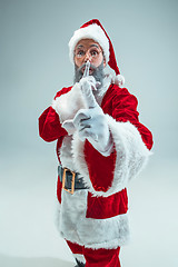 Image showing Funny guy in christmas hat. New Year Holiday. Christmas, x-mas, winter, gifts concept.