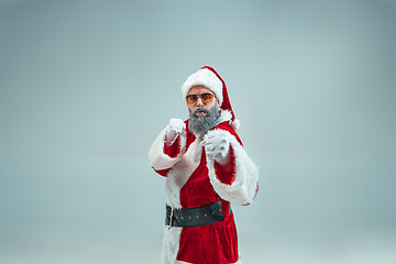 Image showing Funny guy in christmas hat. New Year Holiday. Christmas, x-mas, winter, gifts concept.