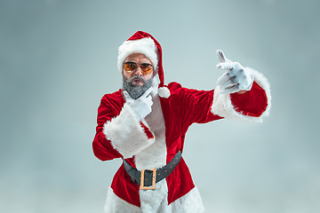 Image showing Funny guy in christmas hat. New Year Holiday. Christmas, x-mas, winter, gifts concept.