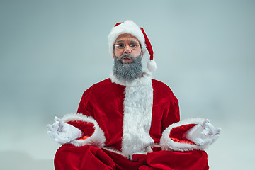 Image showing Funny guy in christmas hat. New Year Holiday. Christmas, x-mas, winter, gifts concept.