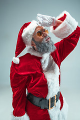 Image showing Funny guy in christmas hat. New Year Holiday. Christmas, x-mas, winter, gifts concept.