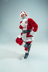 Image showing Funny guy in christmas hat. New Year Holiday. Christmas, x-mas, winter, gifts concept.