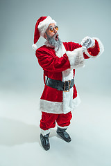 Image showing Funny guy in christmas hat. New Year Holiday. Christmas, x-mas, winter, gifts concept.