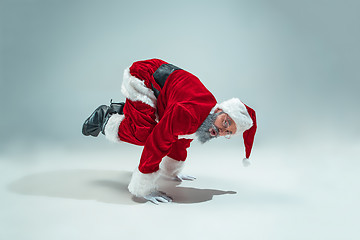 Image showing Funny guy in christmas hat. New Year Holiday. Christmas, x-mas, winter, gifts concept.