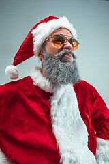 Image showing Funny guy in christmas hat. New Year Holiday. Christmas, x-mas, winter, gifts concept.