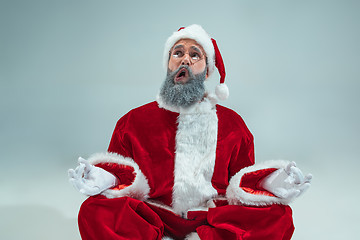 Image showing Funny guy in christmas hat. New Year Holiday. Christmas, x-mas, winter, gifts concept.