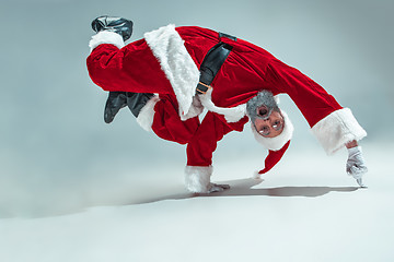 Image showing Funny guy in christmas hat. New Year Holiday. Christmas, x-mas, winter, gifts concept.