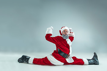 Image showing Funny guy in christmas hat. New Year Holiday. Christmas, x-mas, winter, gifts concept.