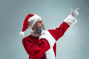 Image showing Funny guy in christmas hat. New Year Holiday. Christmas, x-mas, winter, gifts concept.