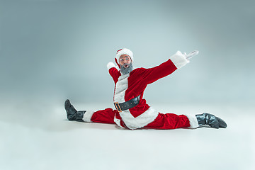 Image showing Funny guy in christmas hat. New Year Holiday. Christmas, x-mas, winter, gifts concept.