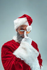 Image showing Funny guy in christmas hat. New Year Holiday. Christmas, x-mas, winter, gifts concept.