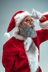 Image showing Funny guy in christmas hat. New Year Holiday. Christmas, x-mas, winter, gifts concept.