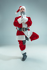 Image showing Funny guy in christmas hat. New Year Holiday. Christmas, x-mas, winter, gifts concept.