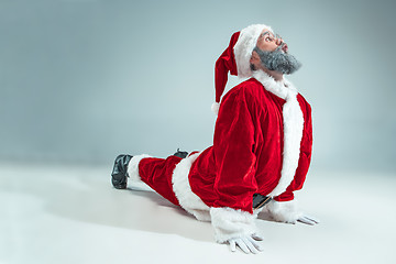 Image showing Funny guy in christmas hat. New Year Holiday. Christmas, x-mas, winter, gifts concept.