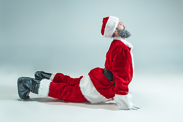 Image showing Funny guy in christmas hat. New Year Holiday. Christmas, x-mas, winter, gifts concept.