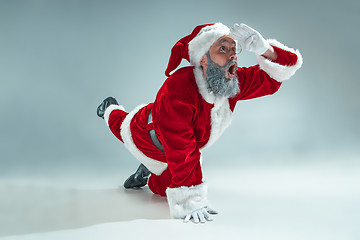 Image showing Funny guy in christmas hat. New Year Holiday. Christmas, x-mas, winter, gifts concept.