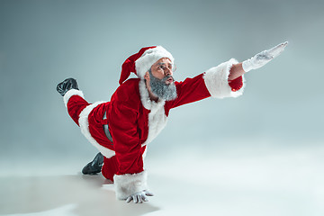 Image showing Funny guy in christmas hat. New Year Holiday. Christmas, x-mas, winter, gifts concept.