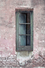 Image showing Old window on exposed brick wall.