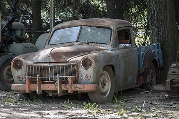 Image showing Old, rusted, abandoned car.