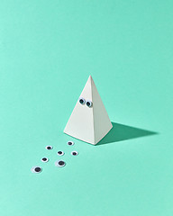 Image showing White plastic pyramid with eyes as Halloween simbol.