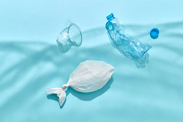 Image showing Ocean plastic garbage in a shadows waves from polyethylene foil.