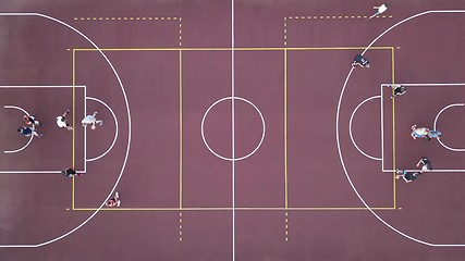 Image showing Men play basketball on the brown field. 4K video, 240fps, 2160p.