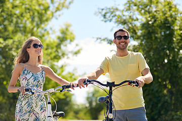 Image showing happy couple with bicycles at country