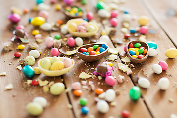 Image showing chocolate easter eggs and candy drops on table