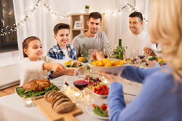 Image showing happy family having dinner party at home