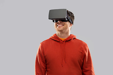 Image showing happy man in virtual reality headset or vr glasses