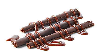 Image showing chocolate sticks with chocolate sauce