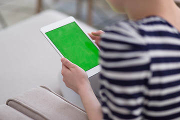 Image showing woman on sofa using tablet computer